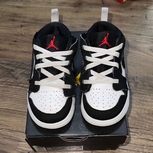 Jordan Kids Black and White Sneakers with Red Accent